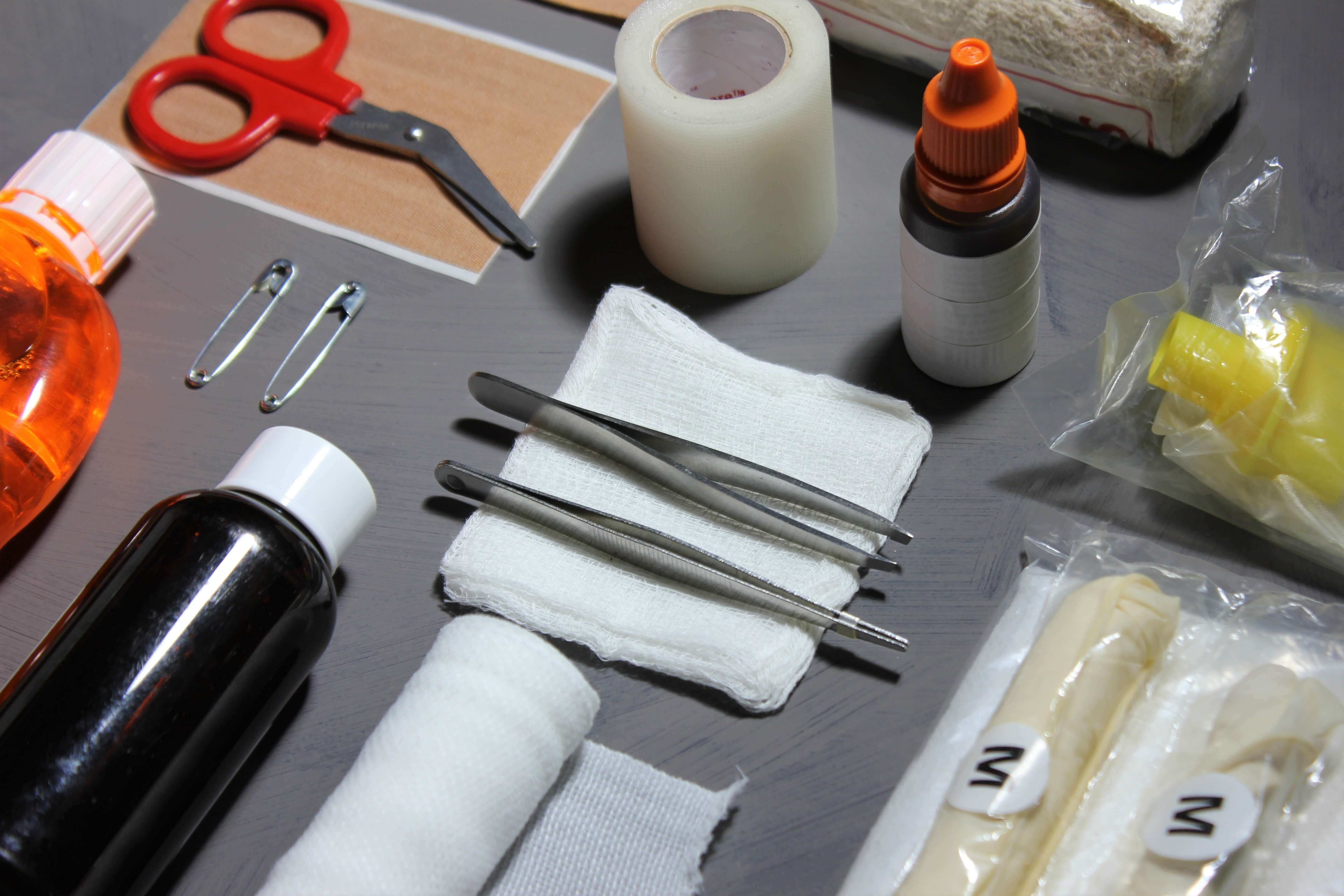 first aid tools layed out on a flat surface